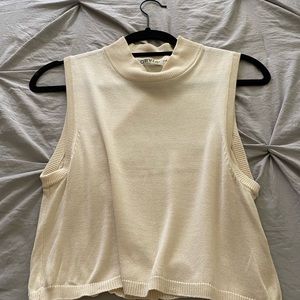 A cream over throw short sleeve sweater
